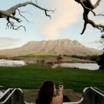 Guest enjoying an outdoor bath overlooking the mountains in North West Tasmania.