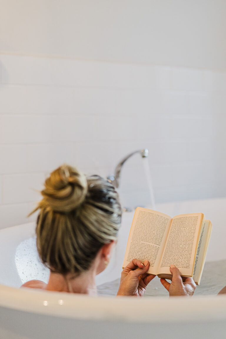 Guest enjoying an outdoor bath overlooking the mountains in North West Tasmania.